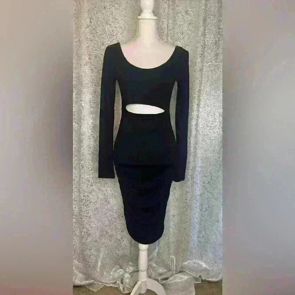 Brand new never worn Black jersey cut out dress. - Picture 1 of 3